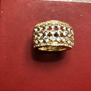 Fancy ring with white sapphire in a gold band, never worn